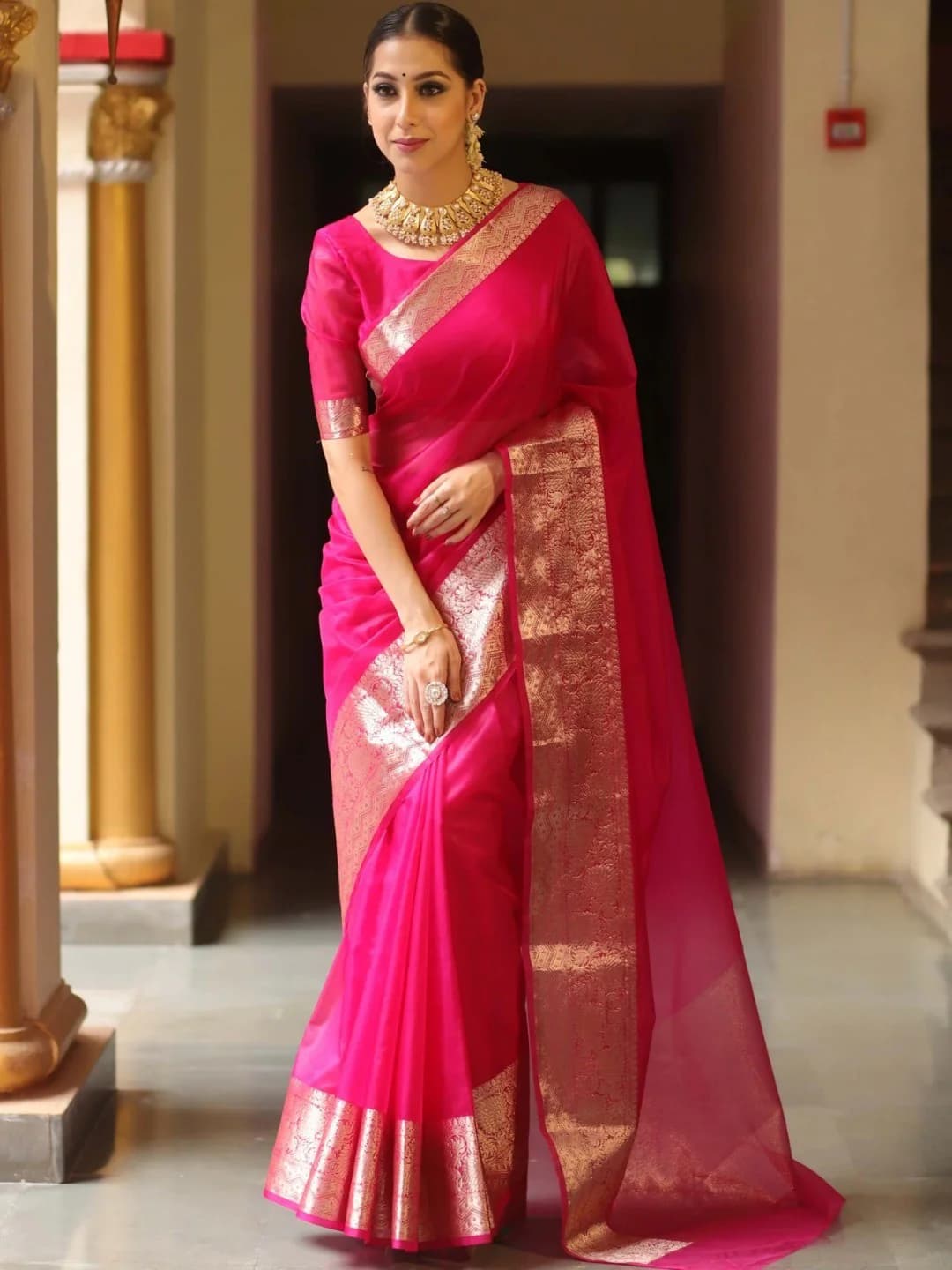 Women's Rani Pink Organza Saree with Floral Golden Zari Woven Border and Unstitched Blouse Piece