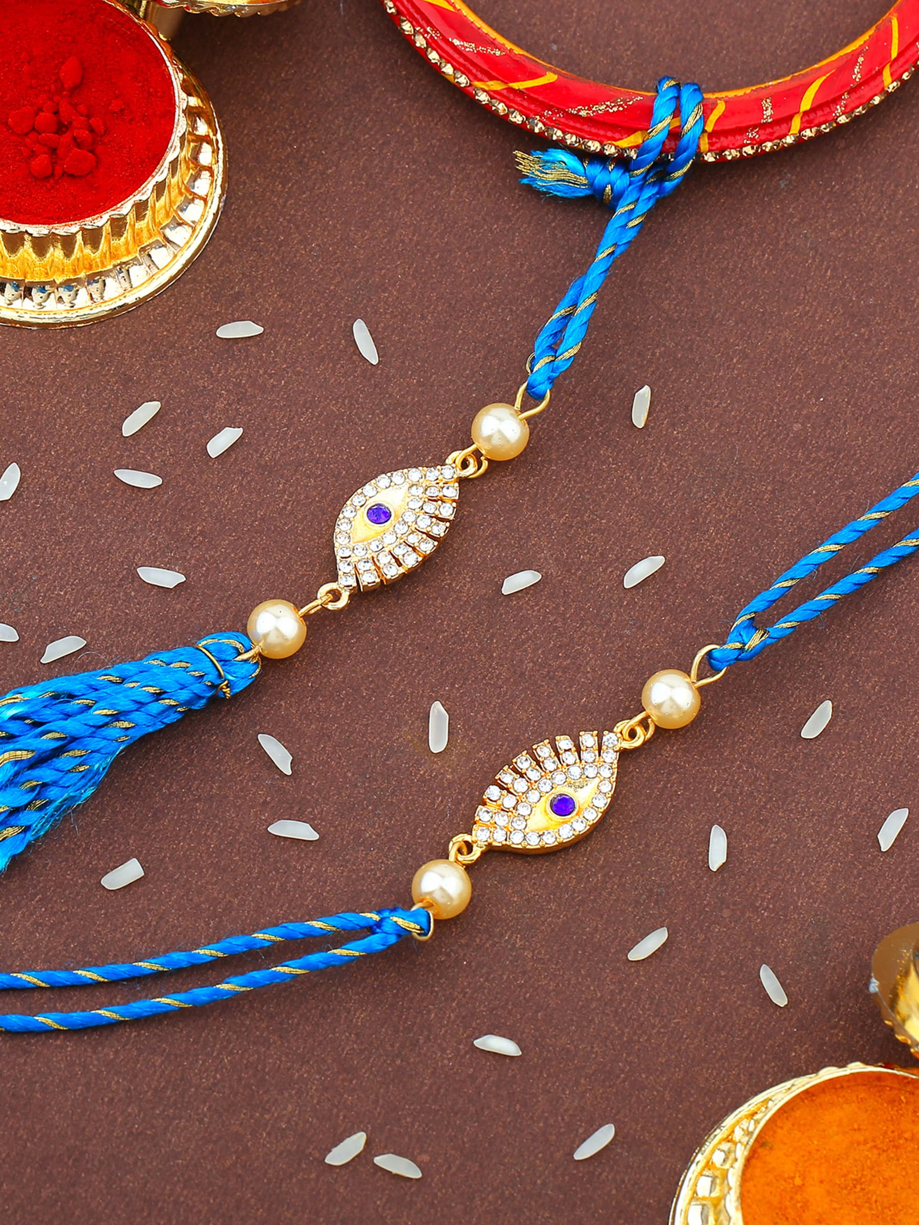 Unisex Gold Plated Evil Eye Rakhi Set for Bhaiya Bhabhi with Crystals and Fancy Silk Thread