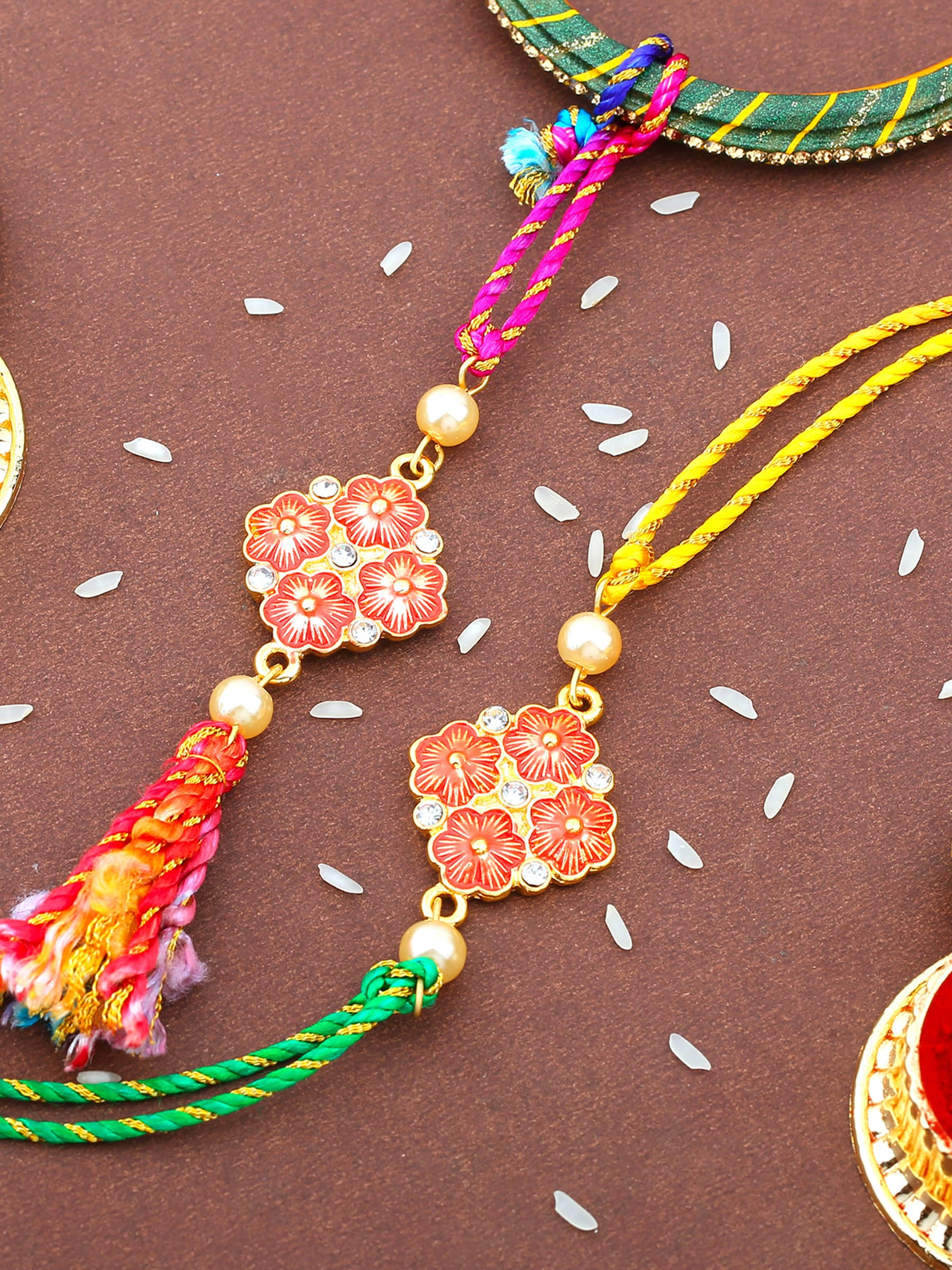 Unisex Gold Plated Floral Design Bhaiya Bhabhi Rakhi Set with Multi-Colored Silk Thread