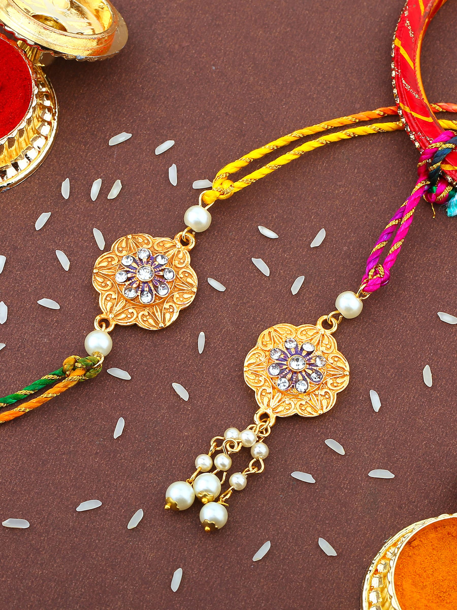 Unisex Gold Plated Flower Shaped Bhaiya-Bhabhi Rakhi Set with Multi-Colored Silk Thread