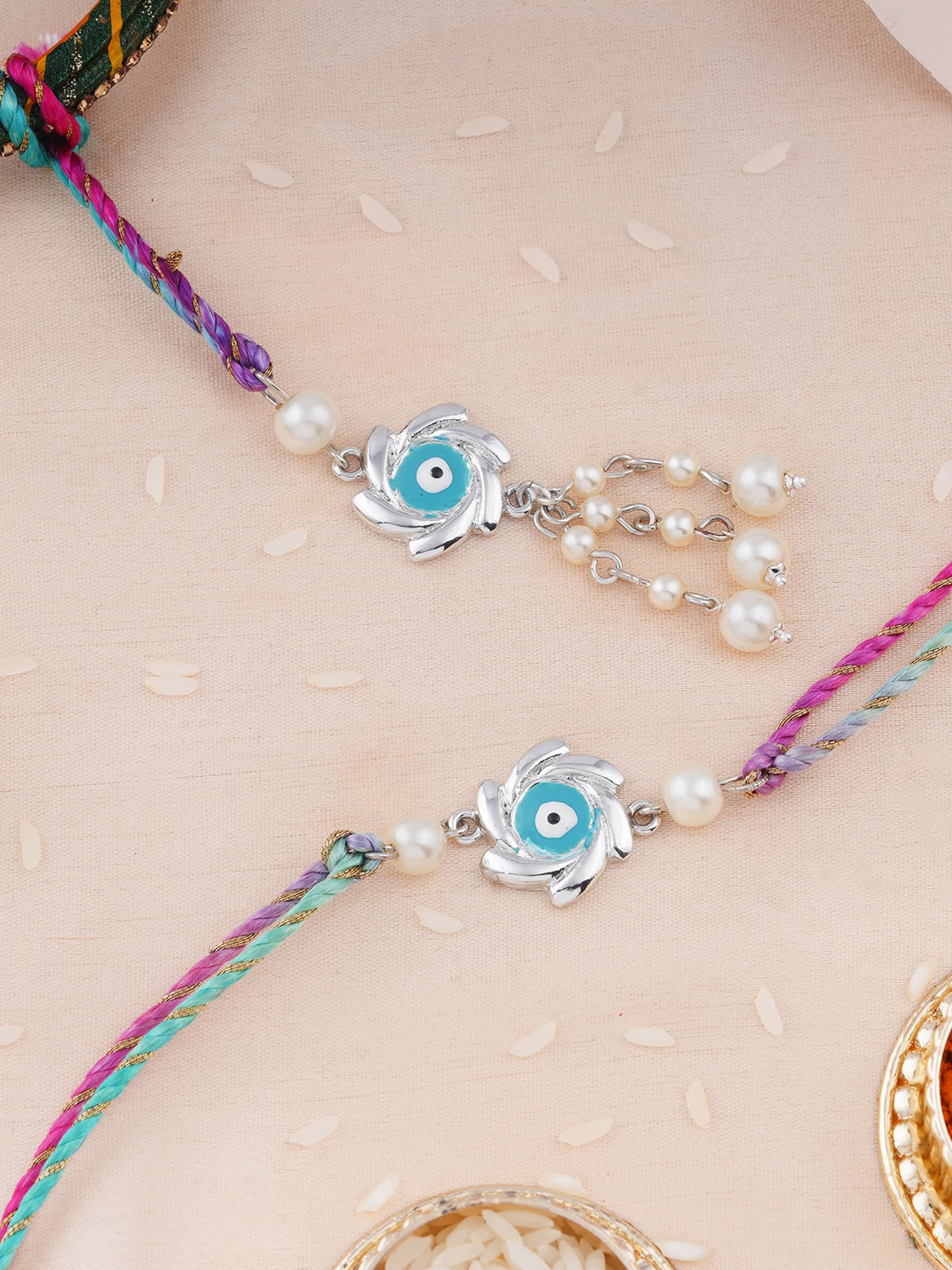 Unisex Rhodium Plated Sudharshan Chakra Design Bhaiya Bhabhi Rakhi Set with Silk Thread