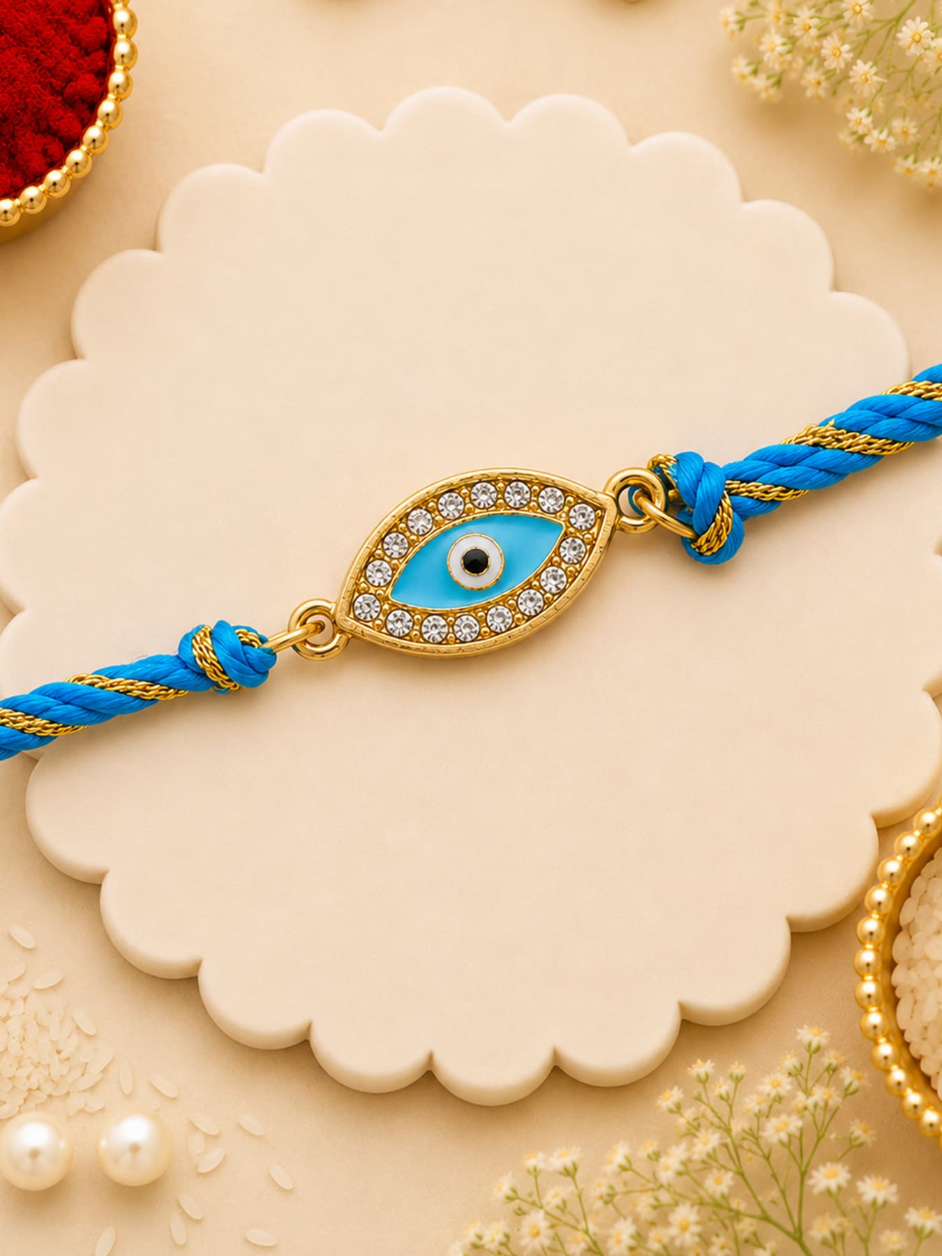 Unisex Gold Plated Spiritual Evil Eye Rakhi with Austrian Crystals and Enamel and Silk Thread