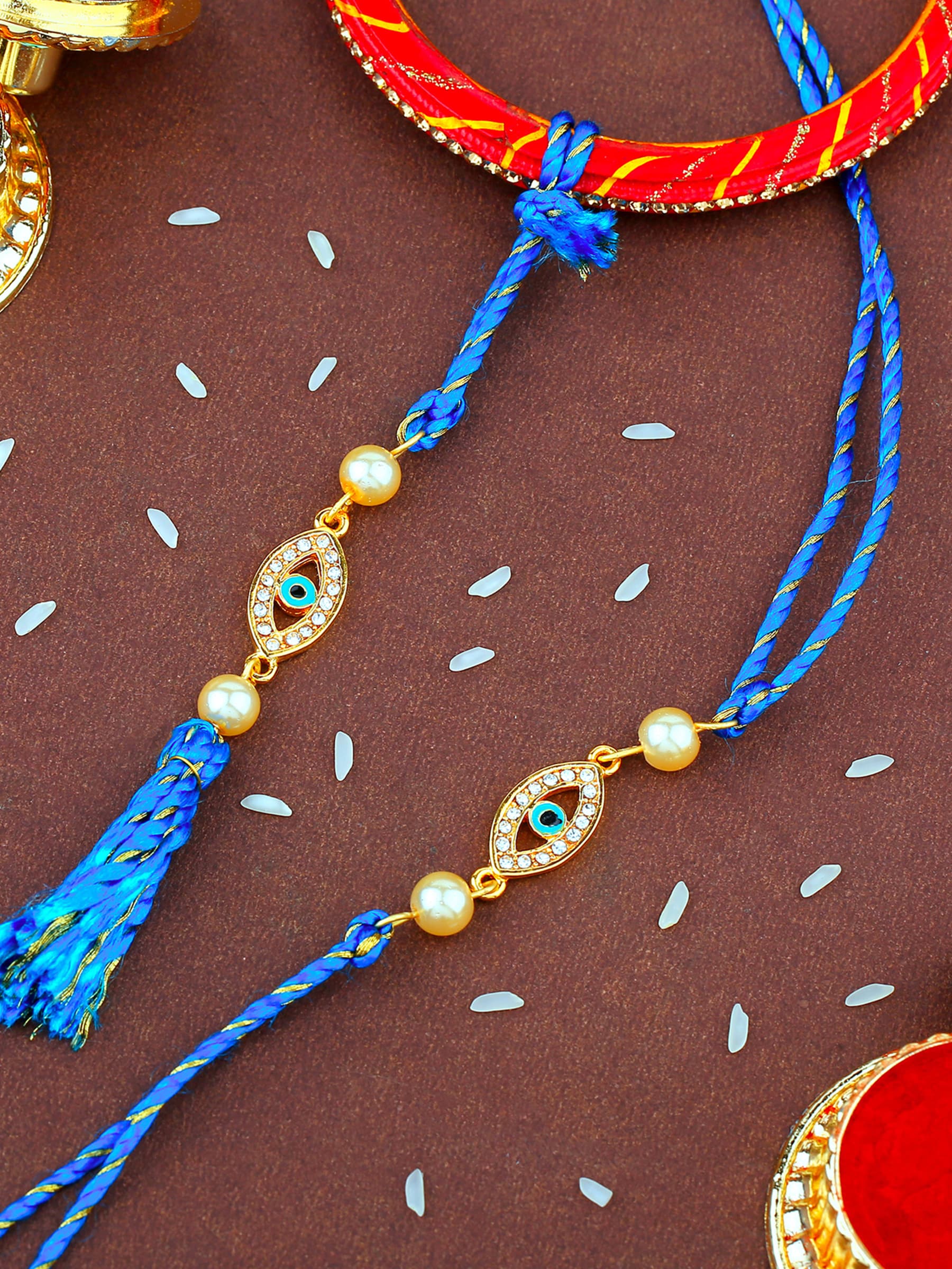 Unisex Gold Plated Evil Eye Bhaiya Bhabhi Rakhi Set with Fancy Silk Thread
