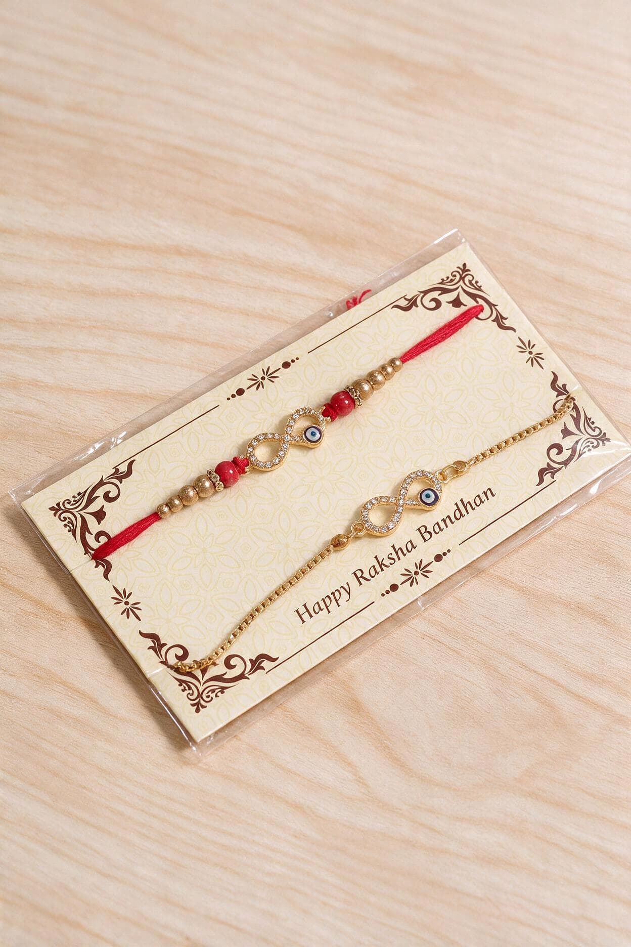 Infinity Charm & Evil Eye Bhaiya-Bhabhi Lumba Rakhi Set